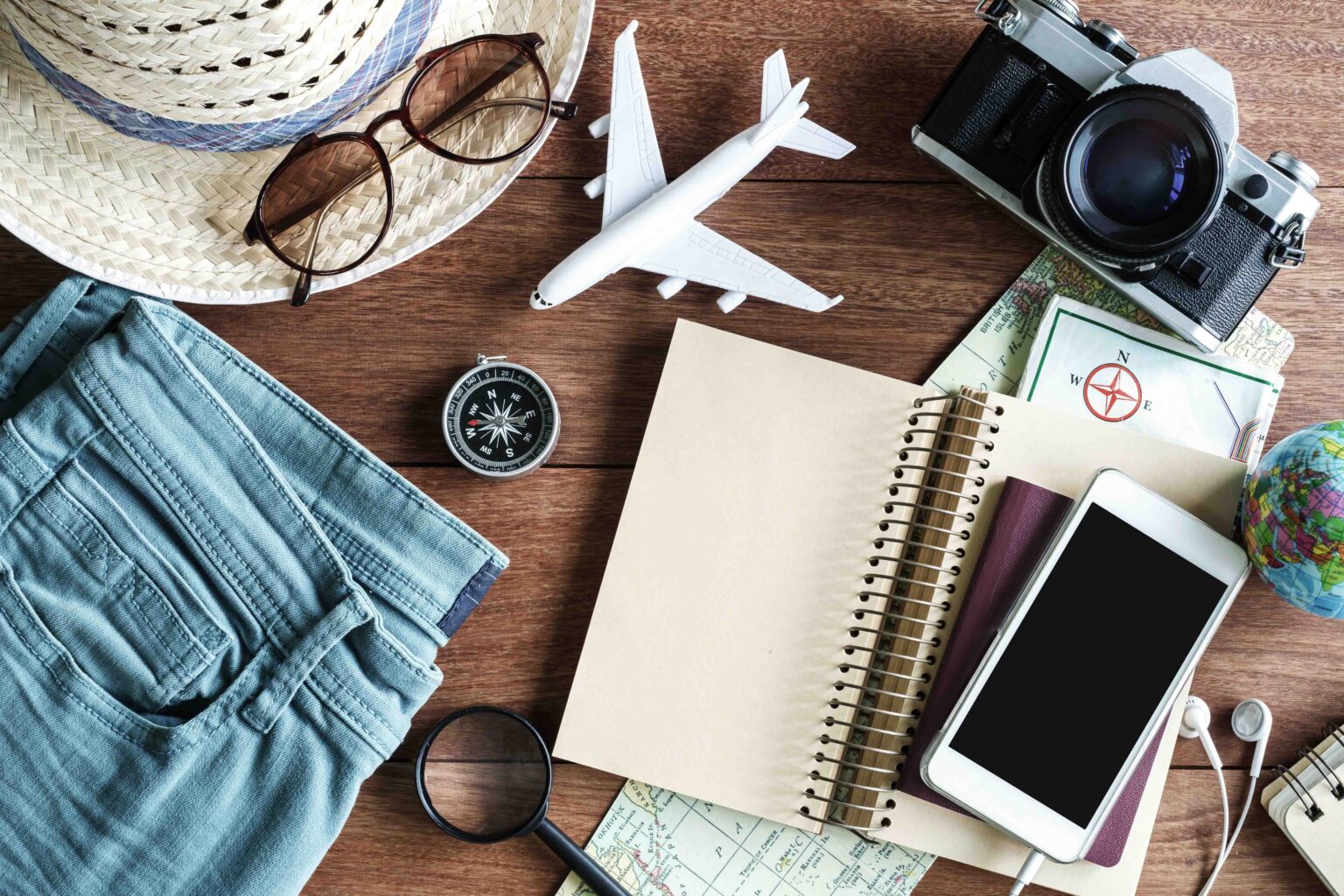 Outfits and accessories of traveler on wooden background with copy space, Travel concept